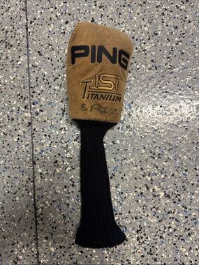 vintage Ping ISI Titanium driver headcover tan suede and a black knit sock.